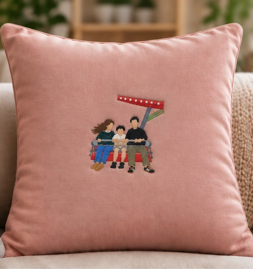 Dusty pink personalised embroidered cushion with family on fairground ride, photo memory gift