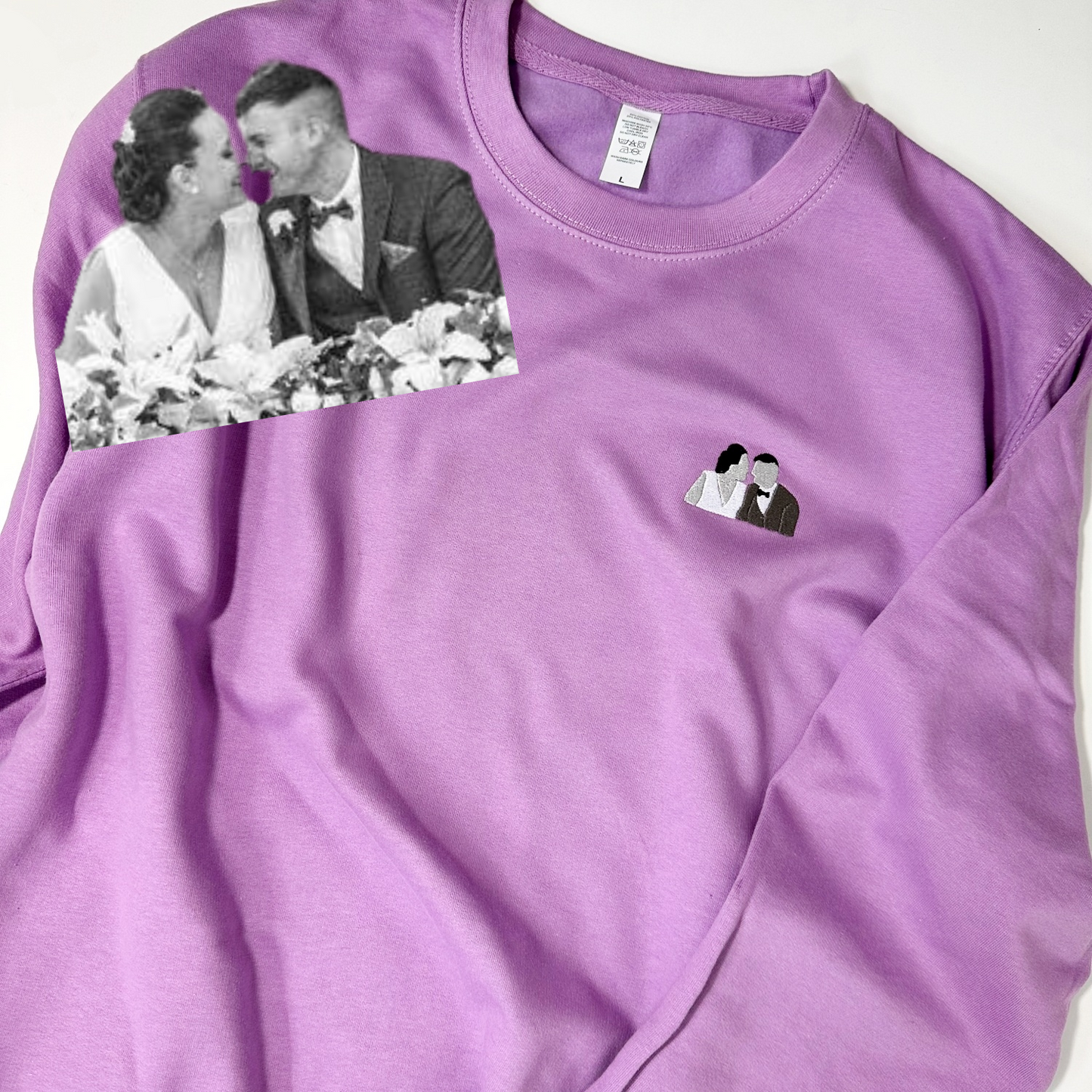 A custom embroidered sweater showcasing a customer's favorite image transformed into a stunning work of art. The sweater features intricate stitching in various colors, bringing the image to life with a textured and detailed design. The embroidery adds depth and dimension to the sweater, making it a unique and personalized piece of wearable art. Perfect for adding a touch of individuality and creativity to any wardrobe.