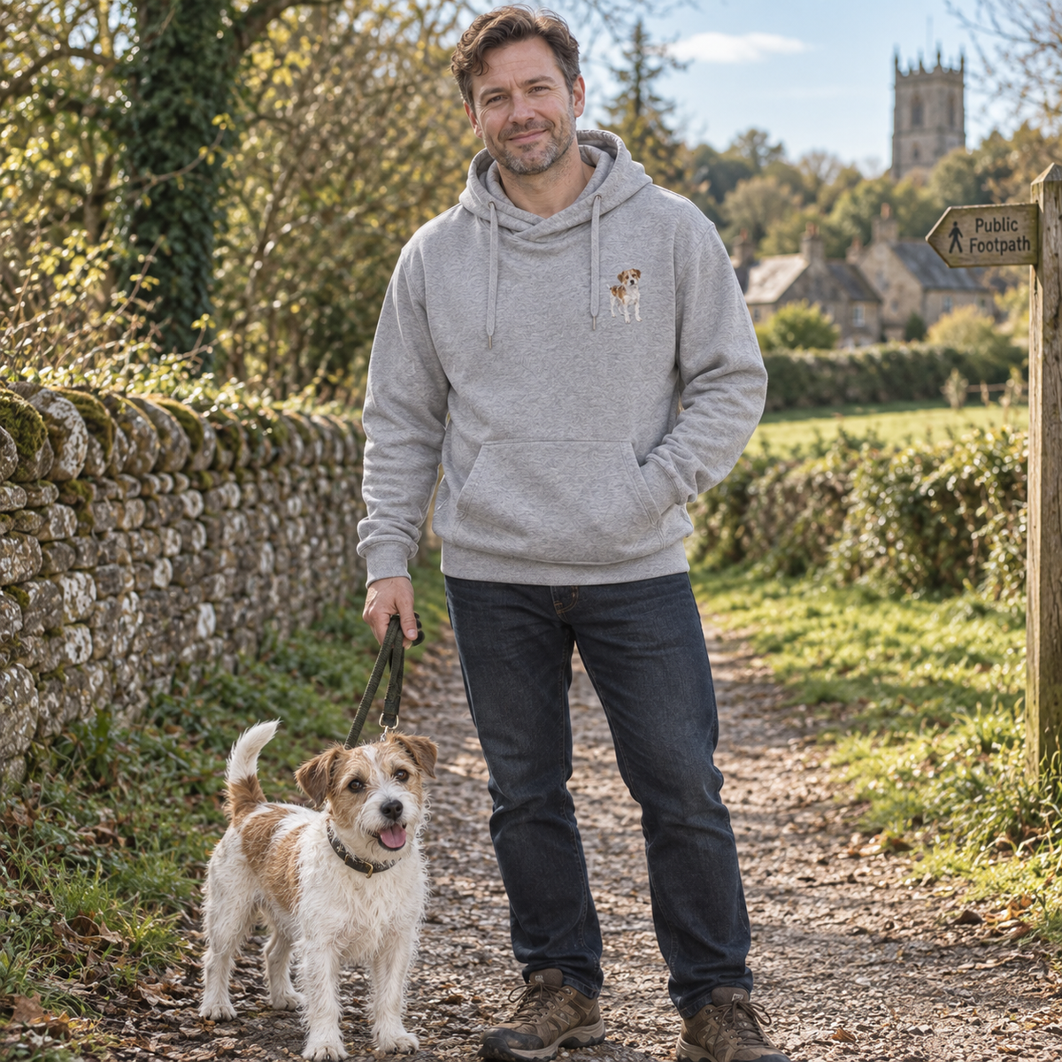 Man wearing a personalised embroidered cross neck hoodie with a full-body dog portrait on a countryside walk
