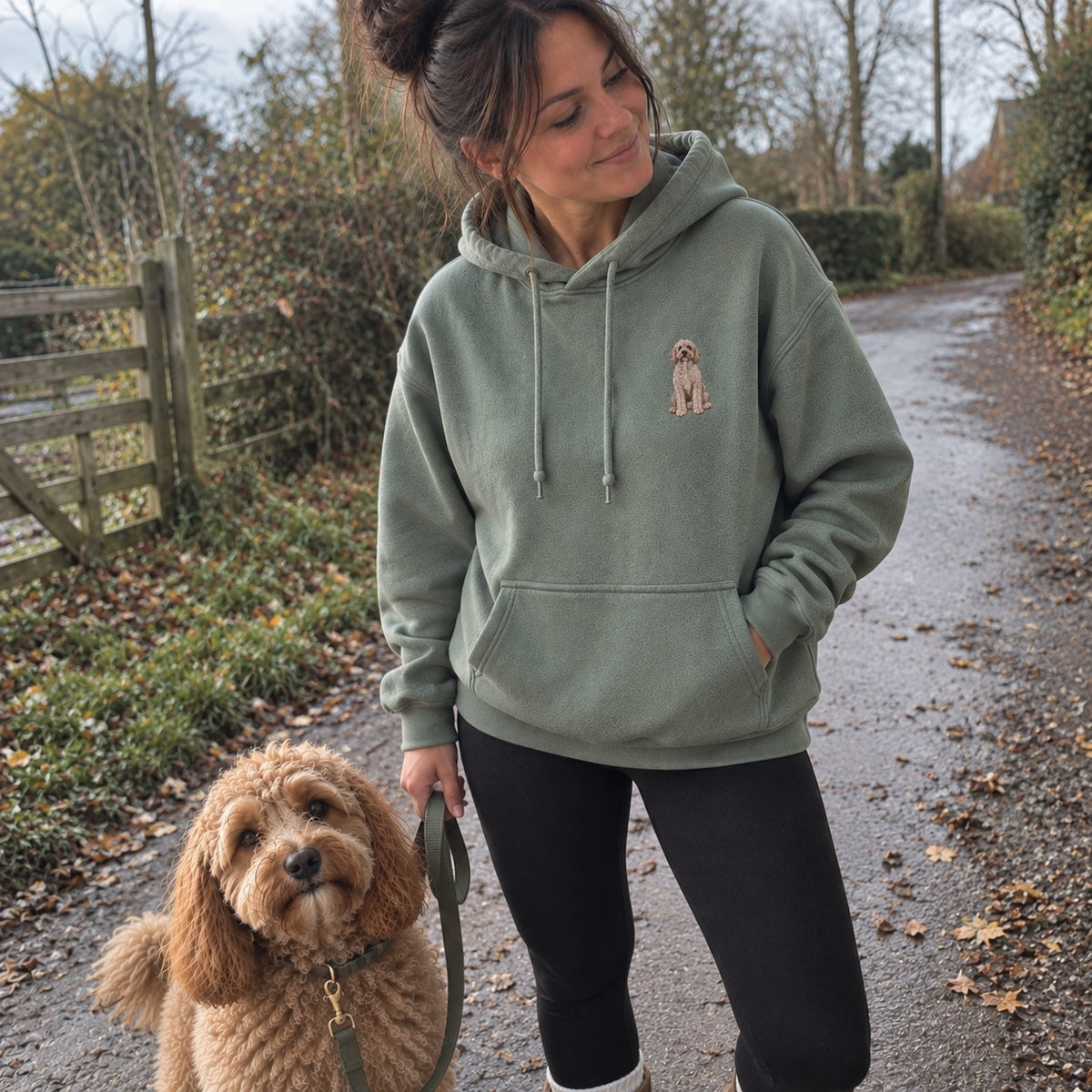 Dusty Green custom dog portrait embroidered hoodie personalised from a pet photo, shown in a natural outdoor UGC lifestyle image