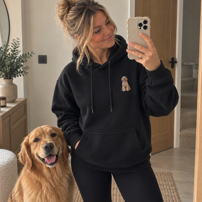 Jet black custom pet photo embroidered hoodie with full-length dog portrait, shown in a standing mirror selfie with a Golden Retriever