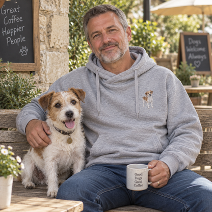 Man wearing a custom embroidered pet portrait cross neck hoodie with his dog in a relaxed outdoor lifestyle photo
