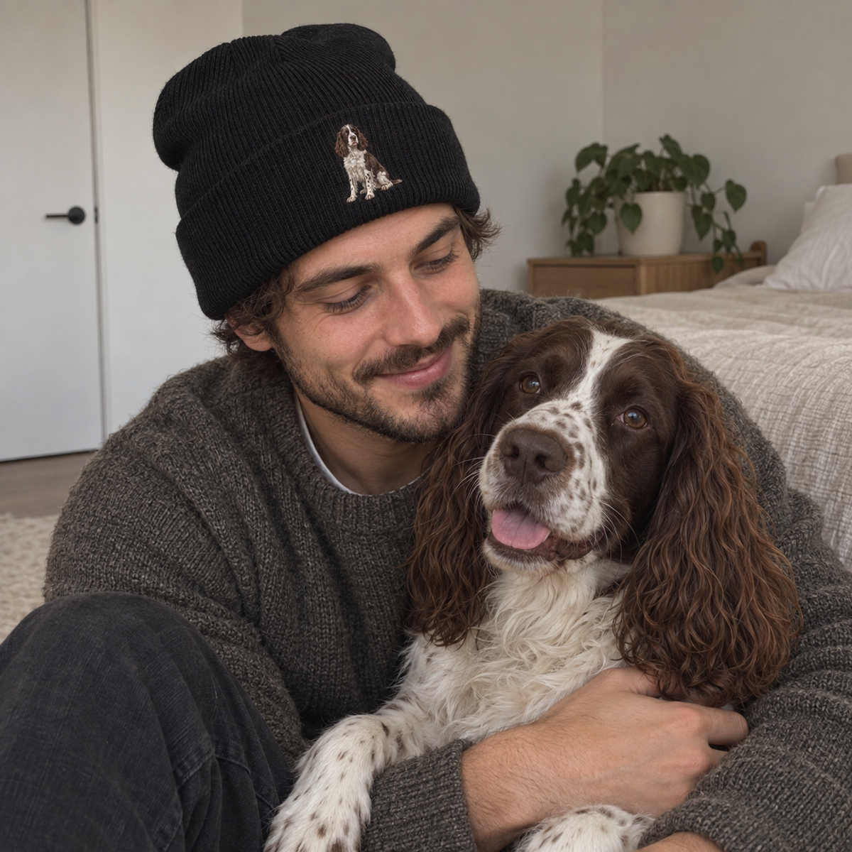 Embroidered pet portrait beanie personalised with a full-body Spaniel design, shown in a natural UGC lifestyle photo