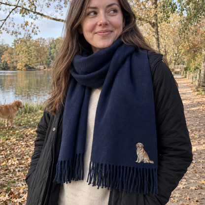 Woman wearing a French navy personalised embroidered dog portrait scarf on an autumn lakeside walk