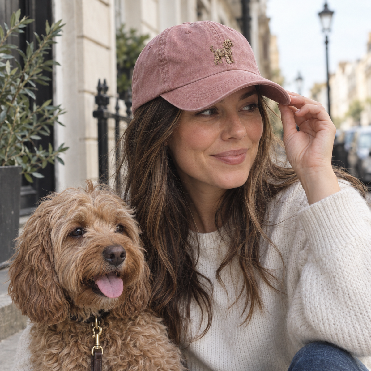 Personalised embroidered dog portrait vintage cap in Vintage Dusky Pink with a full-body curly dog design in a candid UGC photo