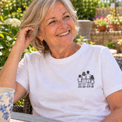 Older woman wearing a personalised outline embroidered T-shirt with a small single-colour family of four design and filled hair