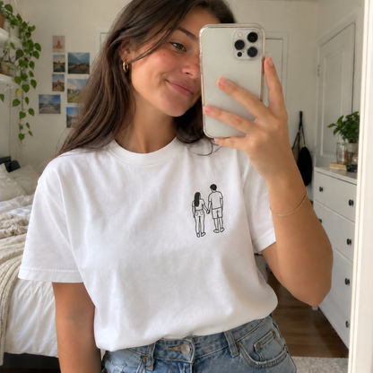Young woman taking a mirror selfie in a personalised outline embroidered T-shirt with a small single-colour couple design and filled hair