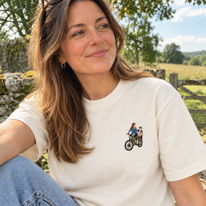 Woman wearing an off-white personalised embroidered photo T-shirt with a small full-colour cycling memory design outdoors