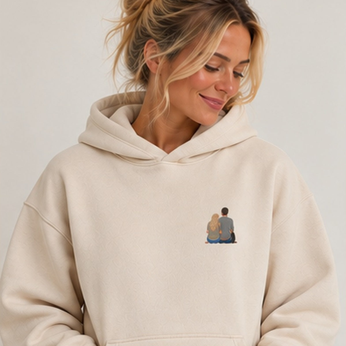 Natural stone personalised embroidered photo hoodie worn by woman, square studio photograph