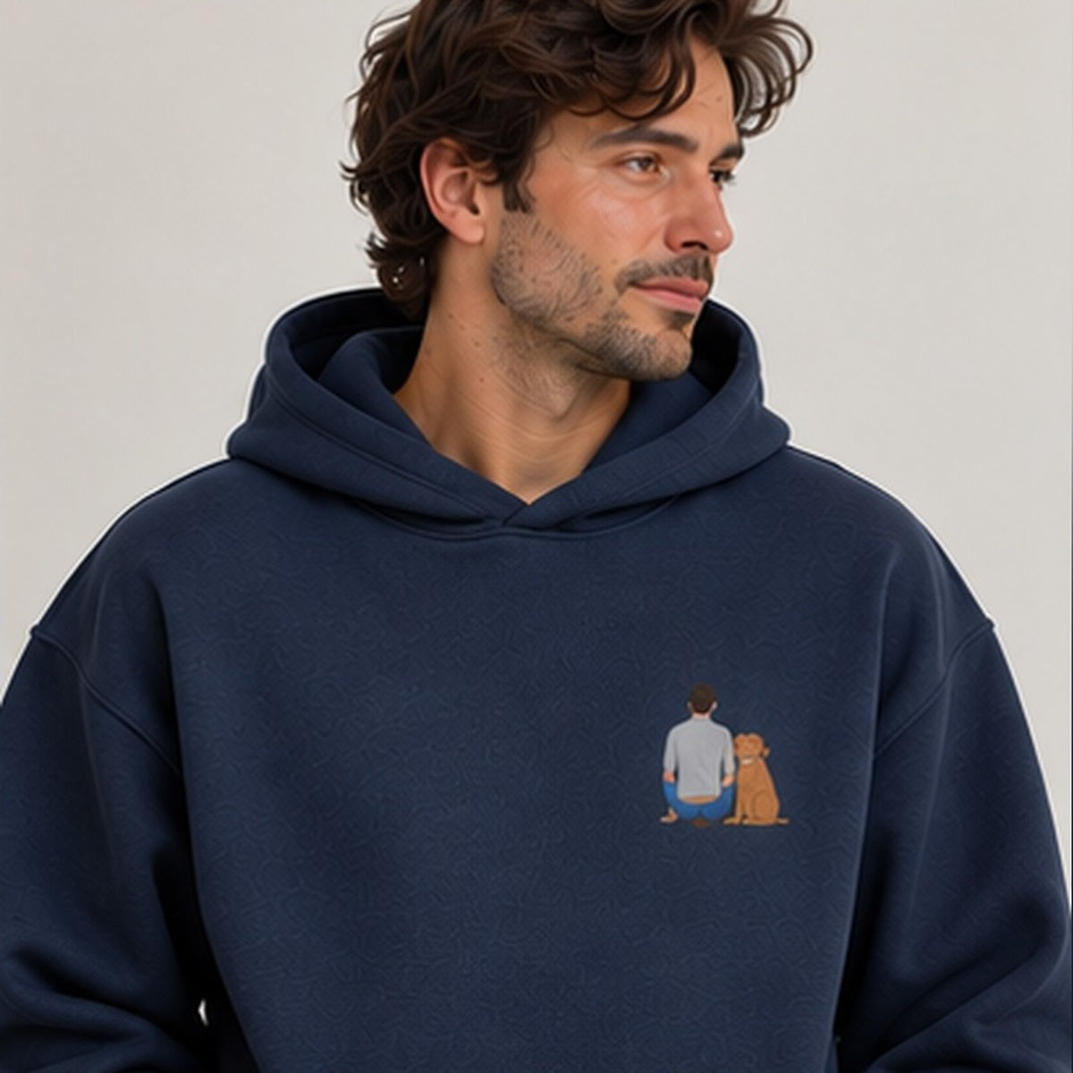 Navy personalised embroidered photo hoodie worn by man, square studio photograph