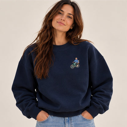Woman modelling a new French navy oversized personalised sweater with a small embroidered cycling memory
