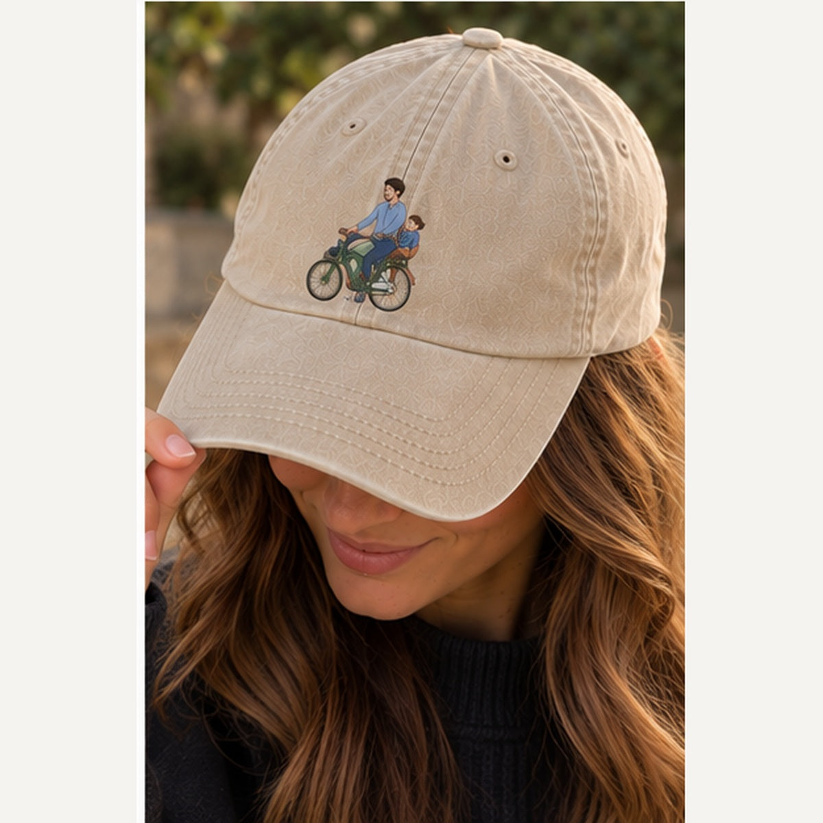Woman wearing stone vintage embroidered cap with a small personalised cycling family design