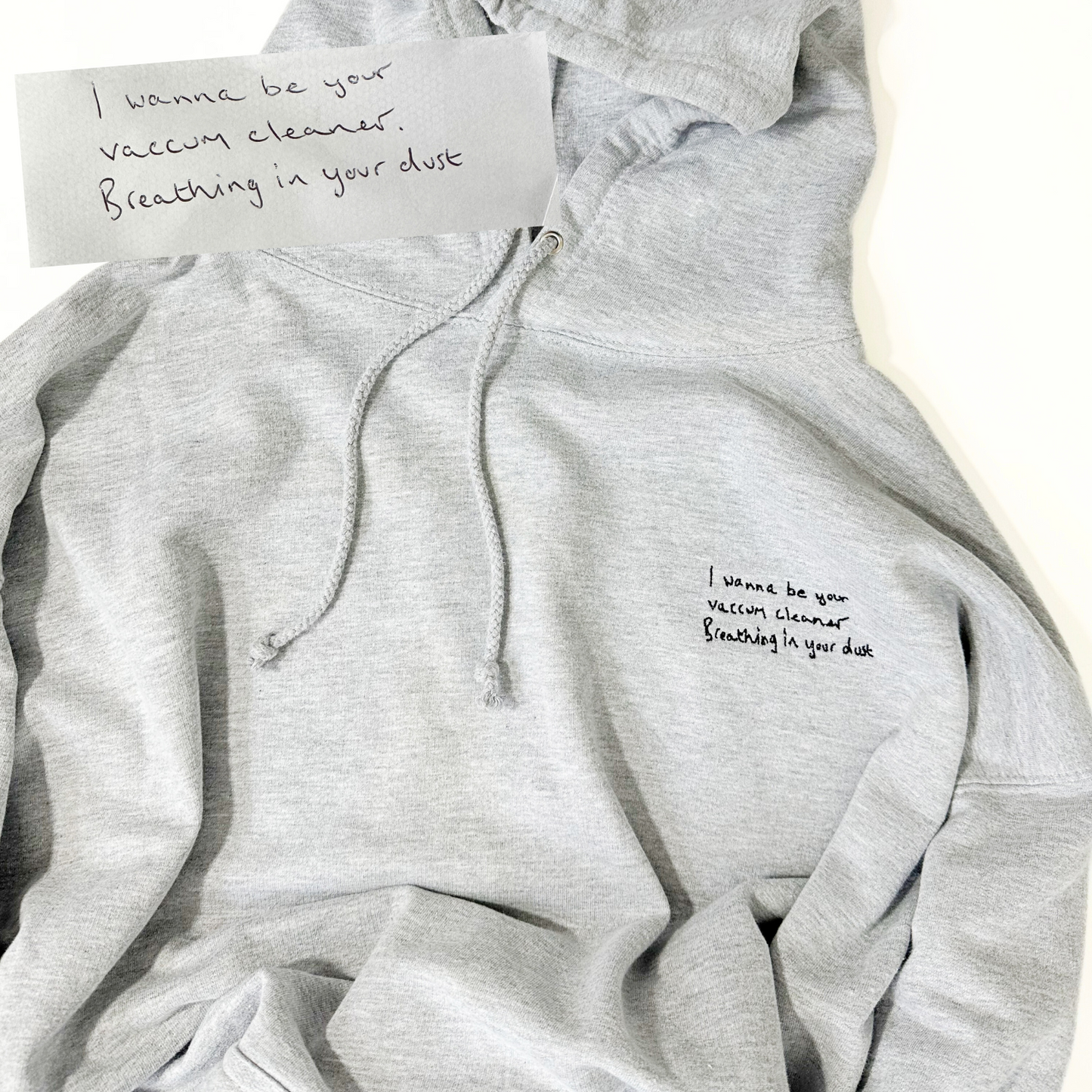 A high-quality hoodie showcasing a beautifully embroidered handwritten note. The heartfelt message is delicately stitched onto the hoodie, adding a personal touch to this unique and meaningful piece of apparel