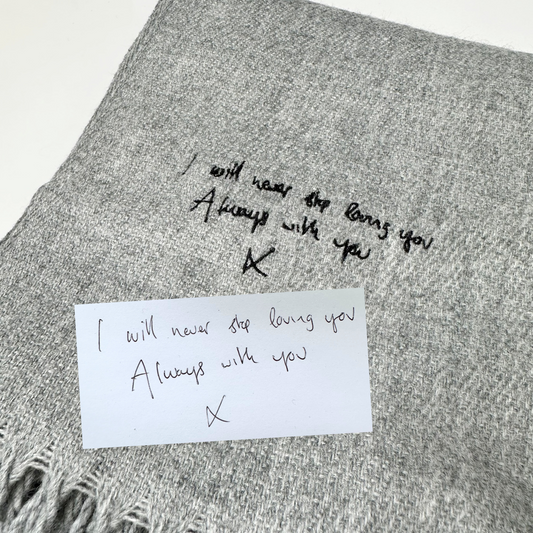  Personalise your style with a hand-written message! Our luxurious scarf features exquisite embroidery of your own handwritten note, adding a touch of sentimental elegance to your wardrobe. Perfect for gifting or treating yourself. Handcrafted with care, this custom scarf is a unique accessory that tells your story